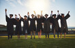 © peopleimages.com - College, graduation and portrait of people holding hands for learning, achievement and success. Happy, friends and students with celebration in row at field for qualification, knowledge and education