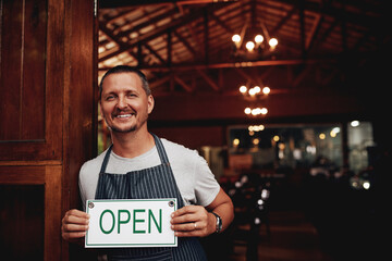 Poster - Entrance, portrait and man with open sign for brewery, invite clients and welcome patrons for customer service. Restaurant, owner and board with message for hospitality, doorway and small business