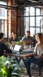 © starush - A group of people sitting around a table with laptops, AI