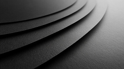 Wall Mural - smooth, unblemished sheet of black paper, highlighting its uniform texture and matte finish, ideal f