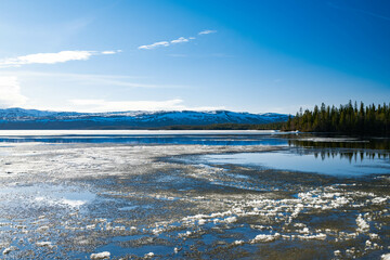 Frozen lake in North Norway with mountains in the background, landscape background