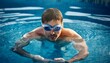 © dmnkandsk - A young man wearing water goggles in the swimming pool
