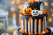 © Vitalii - A close-up of a tasty pumpkin cake with halloween decorations