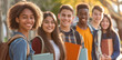 © AnNew - Group of high school students standing together outdoors with books