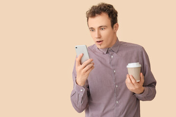 Sticker - Shocked young man with smartphone and coffee on beige background