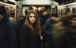 © AI Visual Vault - A Woman Stands Still in a Bustling Subway Station During Rush Hour