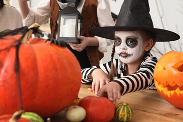 Wall Mural - Little girl celebrating Halloween at home, closeup