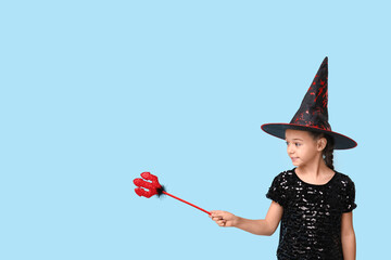 Sticker - Cute little girl dressed for Halloween as witch with red devil pitchfork on blue background