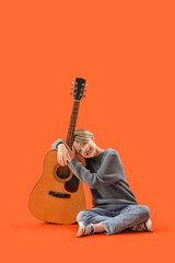 Sticker - Cute little boy with guitar on orange background