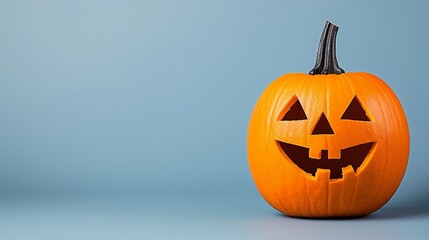 A cheerful Halloween pumpkin with a carved face, perfect for seasonal decorations and festive celebrations.