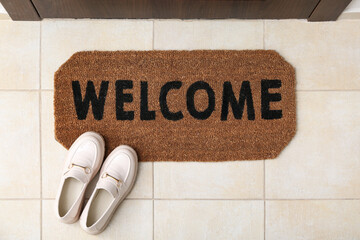 Wall Mural - Brown door mat and shoes on floor in hallway