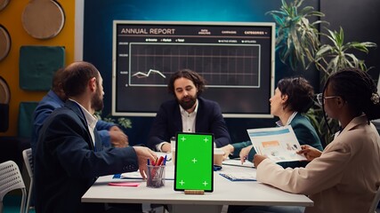 Chief information officer attends meeting with staff members next to isolated screen, discussing latest company achievements and success metrics. Business people share project updates. Camera B.