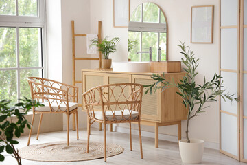 Sticker - Wicker chairs, ladder and chest of drawers in interior of modern bathroom