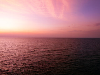 Aerial view sunset sky, Nature beautiful Light Sunset or sunrise over sea, Colorful dramatic majestic scenery Sky with Amazing clouds and waves in sunset sky purple light cloud background