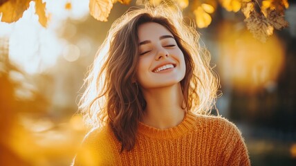 Wall Mural - smiling woman enjoying autumn sunlight surrounded by golden leaves