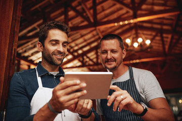 Poster - Men, tablet and barista with pride, small business and colleagues as entrepreneur in cafe. Male people, waiter and technology in industry, hospitality or customer service with confidence at workplace