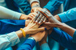 © MVProductions - Diverse group of businesspeople with hands coming together in unity, teamwork, and celebration, success in collaboration,