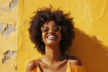 Poster - A woman wearing a bright yellow dress and matching sunglasses, standing outside with a calm expression