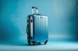 © Yuane - Blue Suitcase on Blue Background