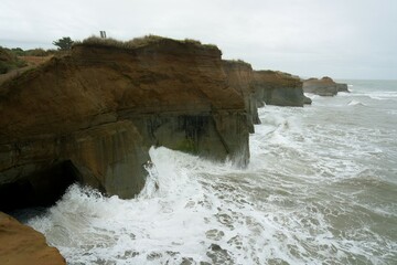 Wall Mural - waves hit the cliff, Stormy weather at Waverley Beach