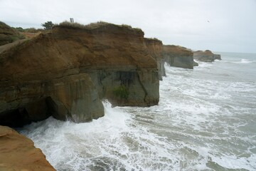 Wall Mural - waves hit the cliff, Stormy weather at Waverley Beach