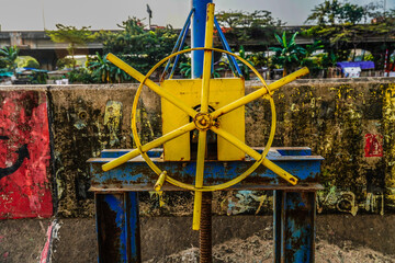 close-up of the steering wheel to open the water dam