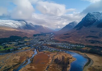 Canvas Print - Aerial View of a Village Nestled Between Majestic Mountains