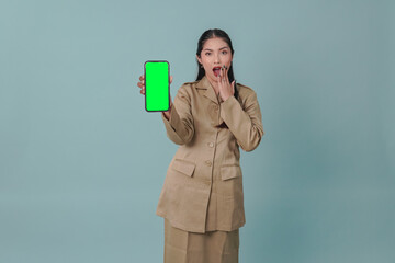 Beautiful government worker woman presenting copy space on her phone with shocked expression.