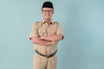 Confident government worker man wearing khaki uniform smiling and standing with his arms crossed.