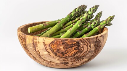 Crisp asparagus in wooden dish on white backdrop.