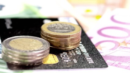 Wall Mural - A black credit card and euro coins