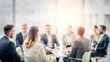 © Mari - Corporate Success Meeting - Blurred background of an office meeting with professionals, reflecting corporate success and development.