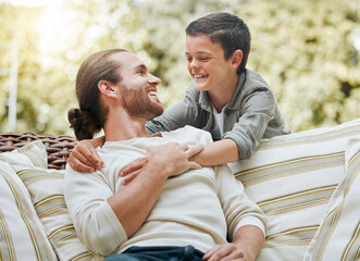 Poster - Father, boy and smile in patio on couch at home for bonding, support and care. People, parent and happy or laughing outside with kid or son for break, relax and rest on sofa with love and trust