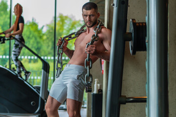 Wall Mural - Portrait of handsome sporty man with muscular body doing weight lifting. Guy workout at gym. Fitness trainer, sport instructor, sporty man, fit model sportsman workout. Power athletic guy bodybuilder.