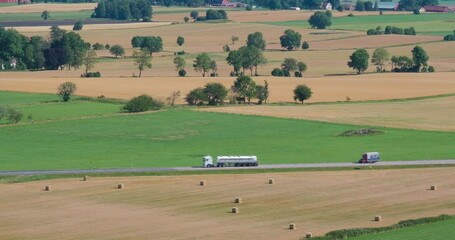 Poster - Country road with trucks and cars in the countryside