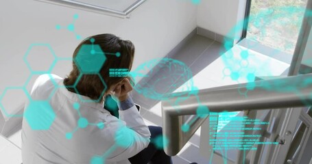 Poster - Sitting on stairs, person in lab coat with brain scan animation overlaid