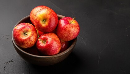 Wall Mural - Apple in a bowl on a black background