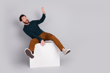 Poster - Photo of worried nervous man wear stylish green clothes look empty space isolated on gray color background