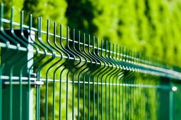 metal sectional fence close-up on green background