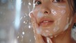 © ThuyTrang - A close-up of an Asian model using a mild exfoliant, her skin looking smooth and renewed, soft lighting, clean background, capturing the exfoliation process, hd quality, beauty focus. --ar 16:9 --v 6.