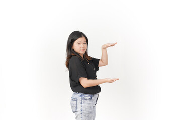 Wall Mural - Young Asian woman Measuring and Showing Big Product wearing Black t-shirt and jeans isolated on white background