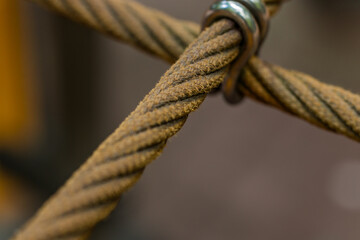 rope crossing net nautical close up macro photography object with narrow focus old frayed material blurred background