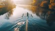 © VK Studio - An early morning rowing team glides across a misty river, surrounded by serene, colorful autumn foliage and illuminated by soft, golden light.