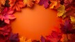 © lucegrafiar - Colorful autumn leaves framing an orange background. Copy space