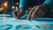 © AUNTYANN STUDIO - A person analyzing financial charts and data with a pen, focusing on business analytics at a desk with paperwork during the evening hours.