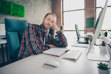 Wall Mural - Portrait of successful young man worker sleep desktop wear plaid shirt modern loft business center indoors