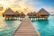 © Maxim Borbut - Under a picturesque sunset sky, overwater bungalows are pictured. Stock photo