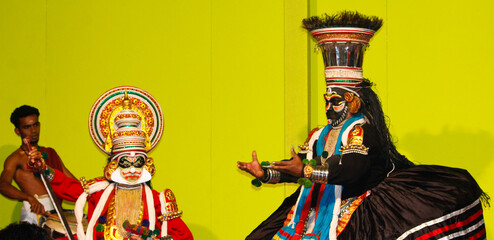 MUNNAR, INDIA - FEBRUARY 10, 2016: Kathakali dancer performing with other two artists in Munnar of Kerala's state in India.