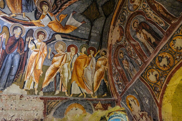 Frescoes on a wall of cave church in Goreme, Cappadocia, Turkey.