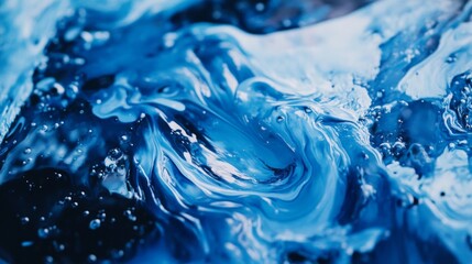 Leinwandbilder - A close-up of blue paint being poured onto a canvas, with brush strokes creating abstract patterns, capturing the creativity and flow of the artistic process.
